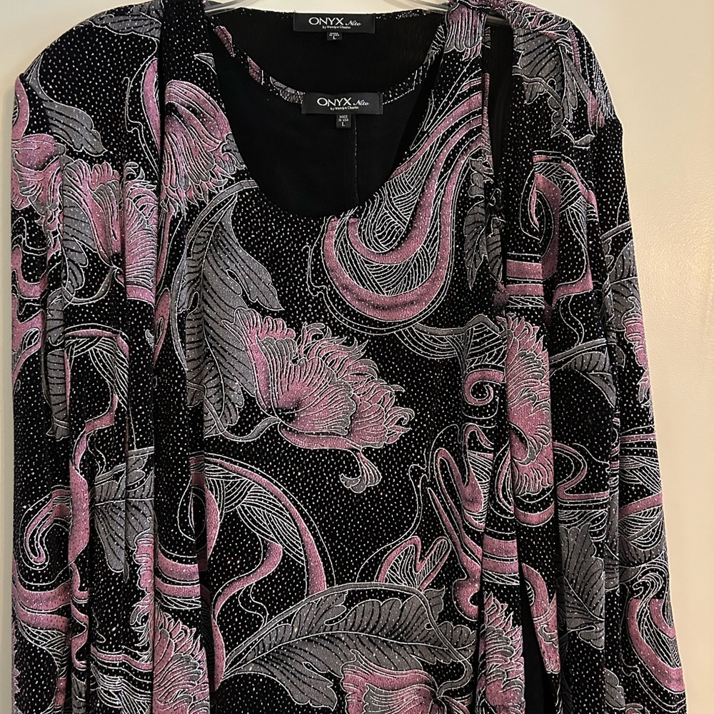 Glitzy two-piece top. Perfect for a special occasion. Just cleaning out closet.